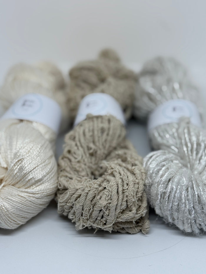 Organic recycled yarns, handmade by our women's co-ops in India.