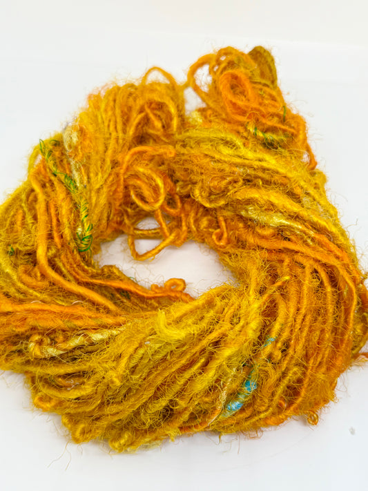 Sari silk yarn, recycled silk fibres from sari mills. Weaving, crochet and knitting crafts.