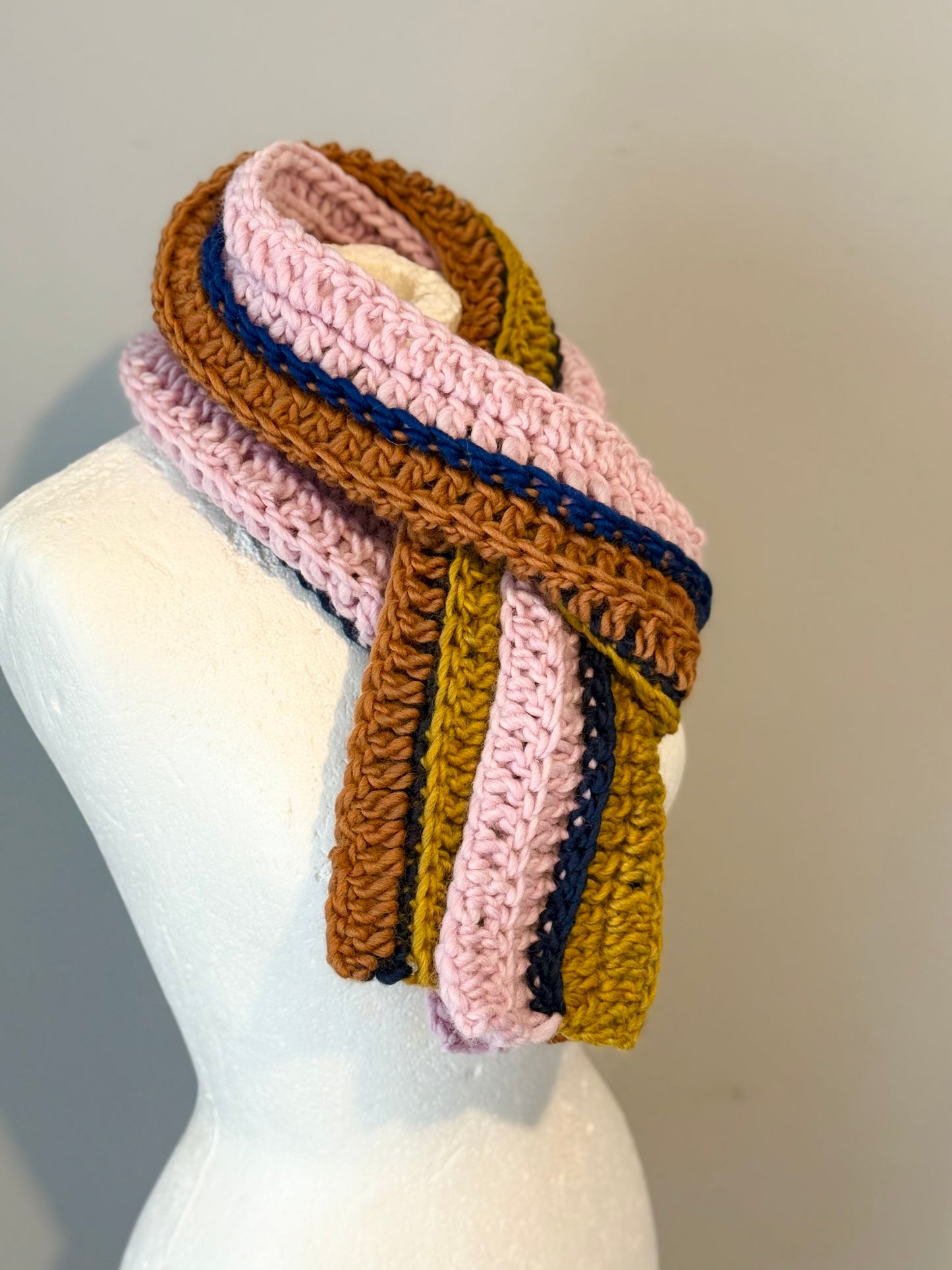 Crochet Norwegian wool scarf in ribbed long vertical lines.