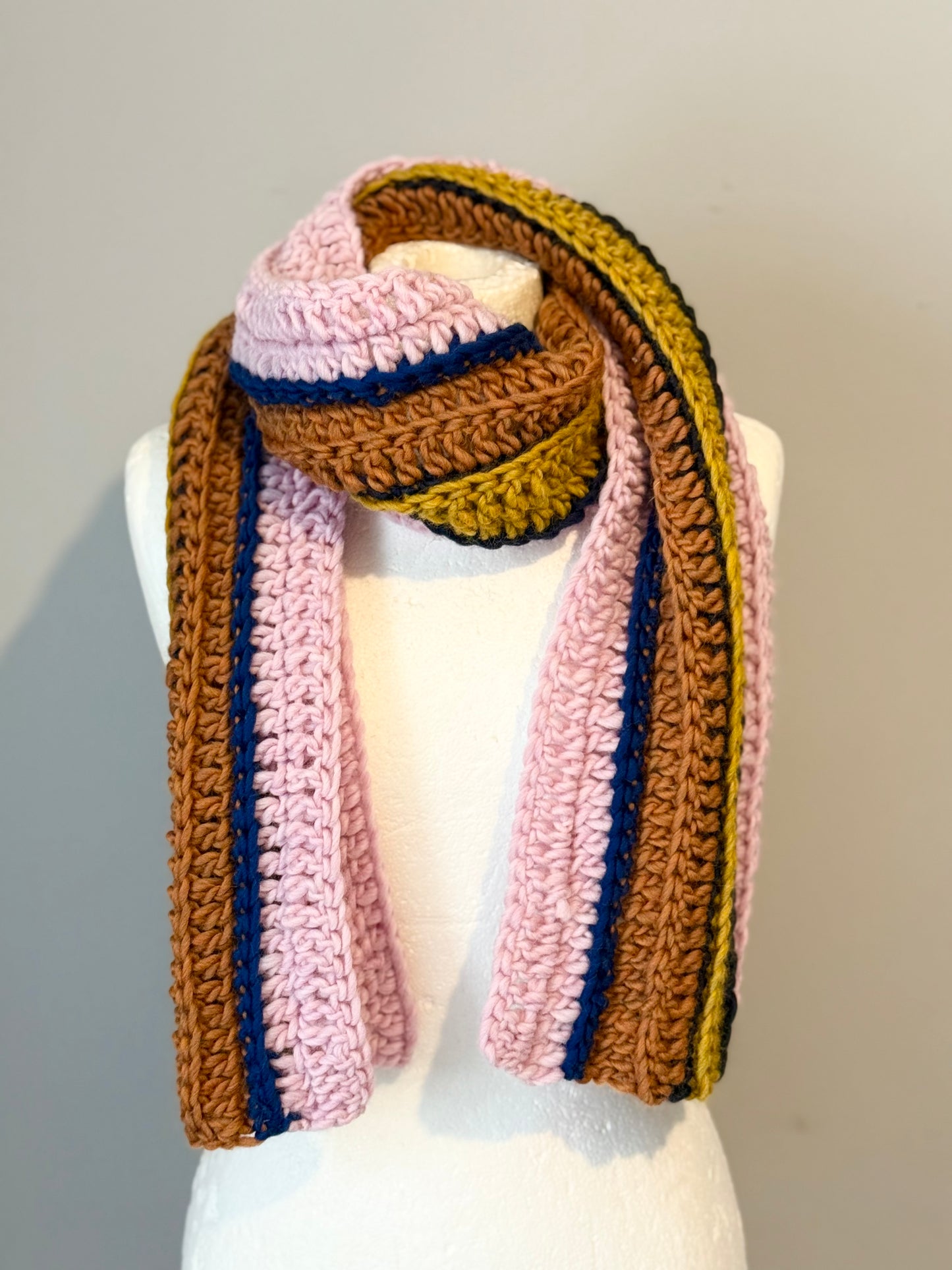 Crochet Norwegian wool scarf in ribbed long vertical lines.