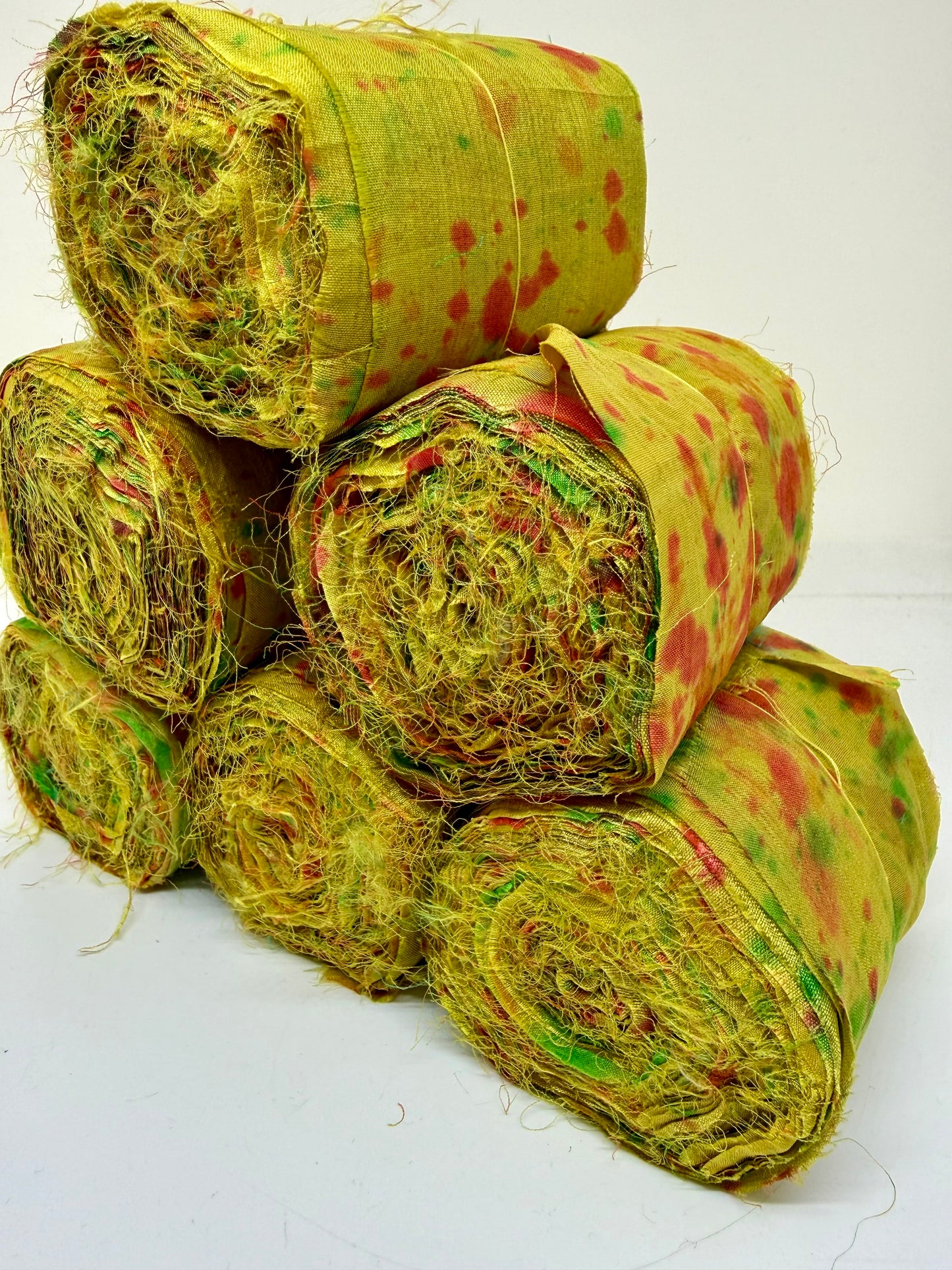 Sari silk fabric rolls hand spray dyed. Moss lit green