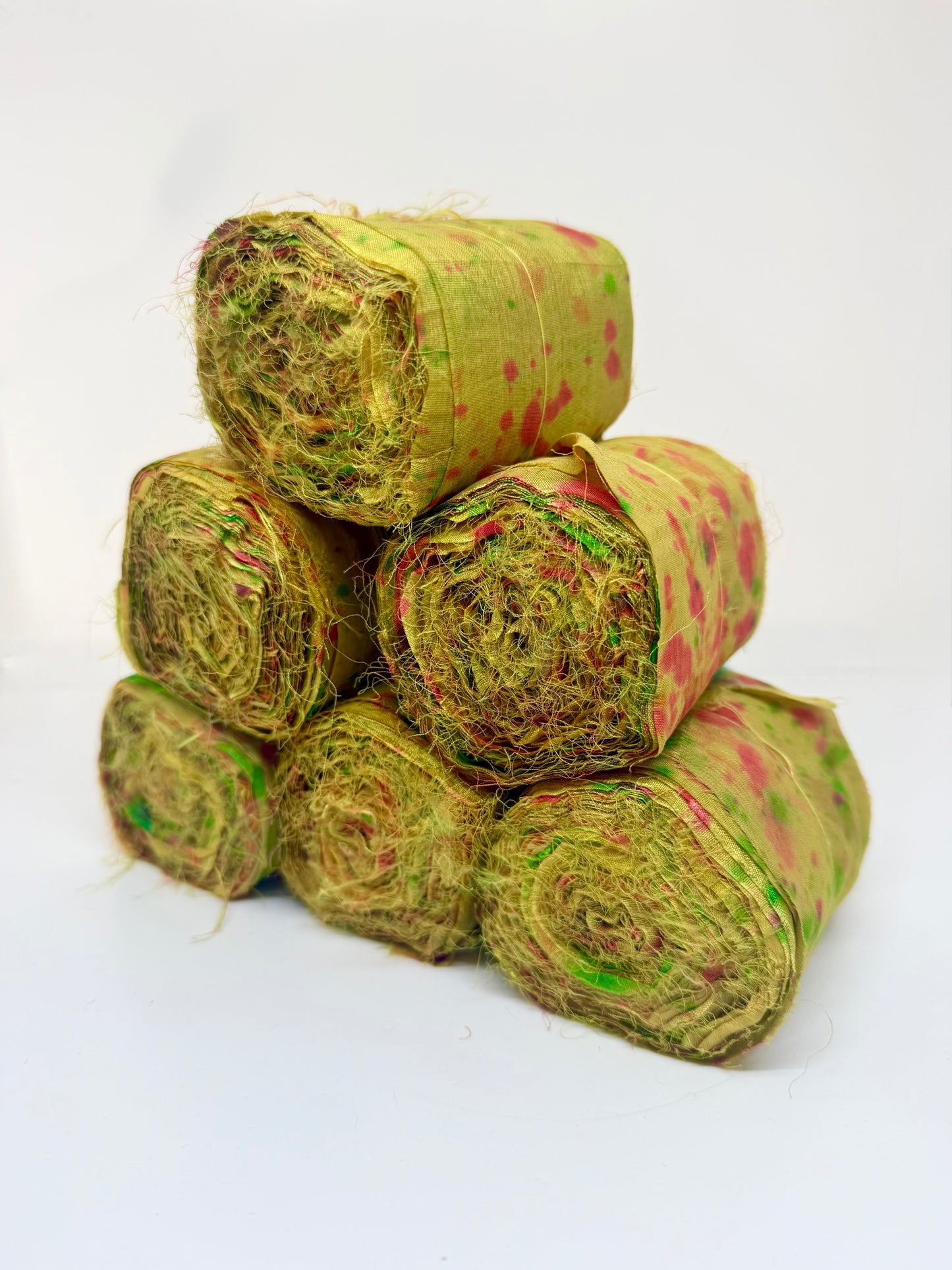 Sari silk fabric rolls hand spray dyed. Moss lit green