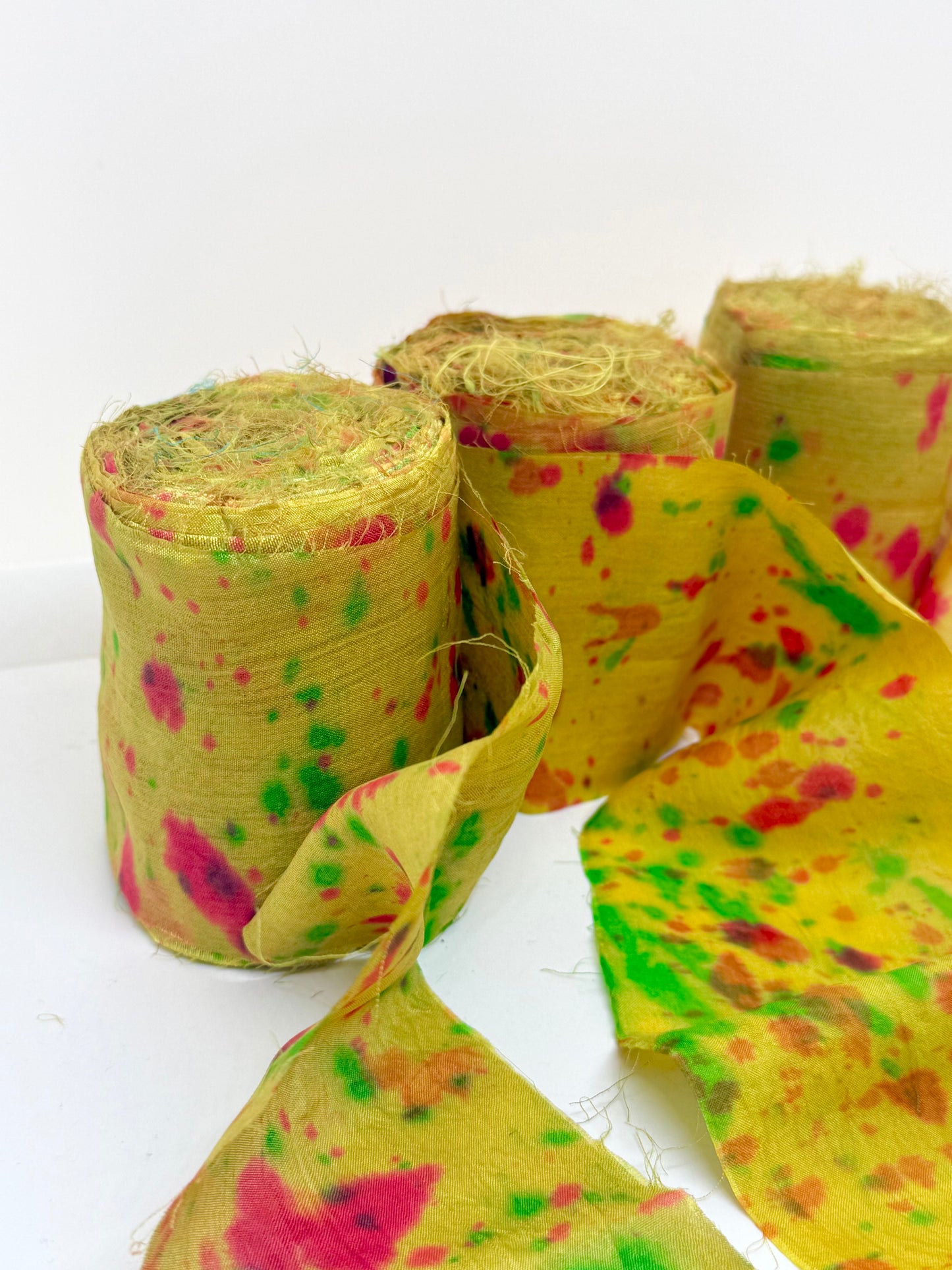 Sari silk fabric rolls hand spray dyed. Moss lit green