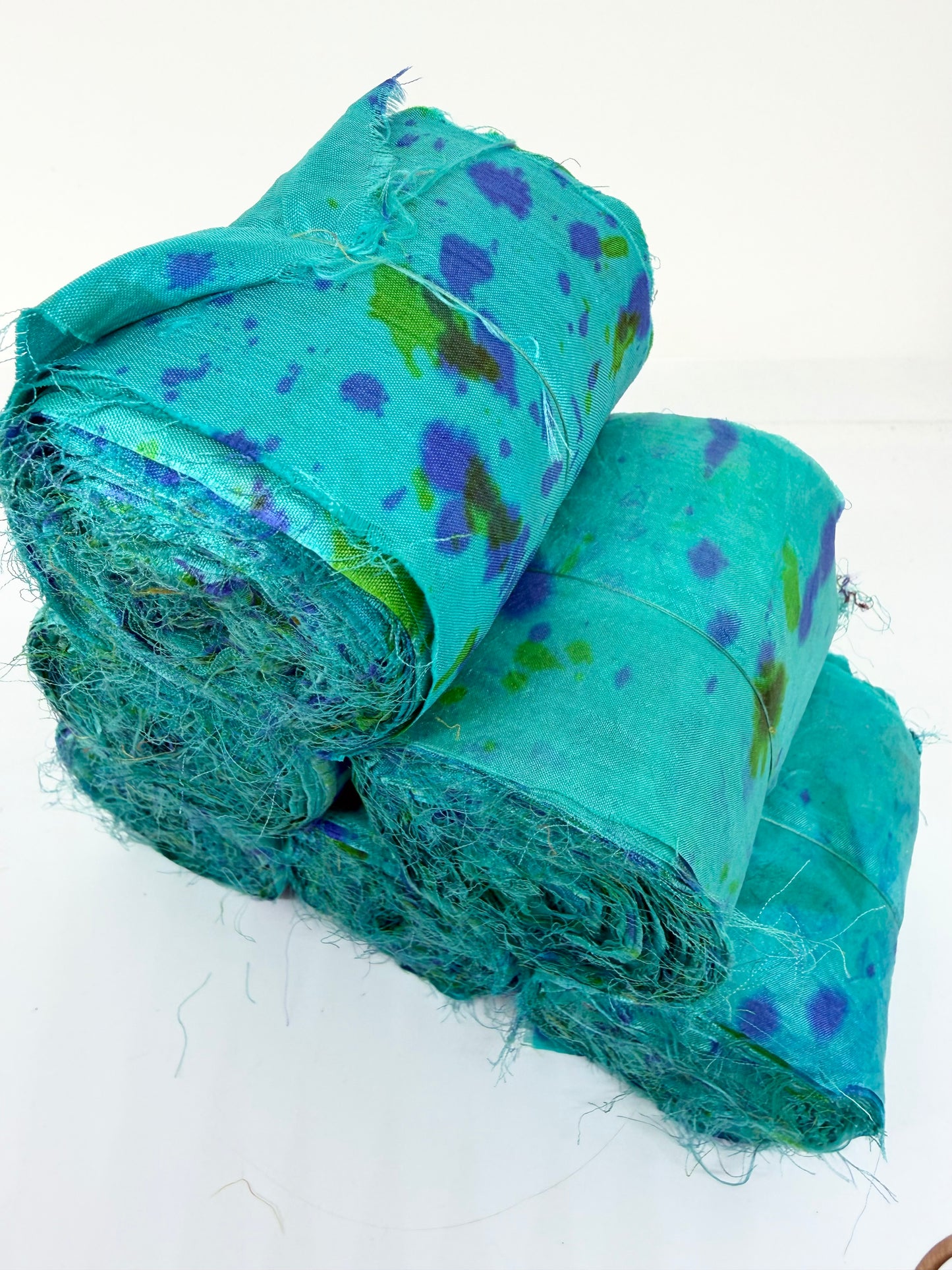 Sari silk fabric rolls hand spray dyed. Blue Reef
