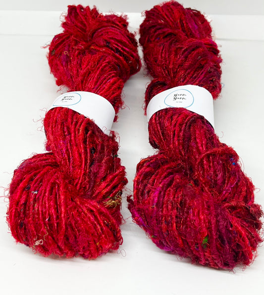 Sari silk yarn, Ruby Red. Sustainable waste silk.