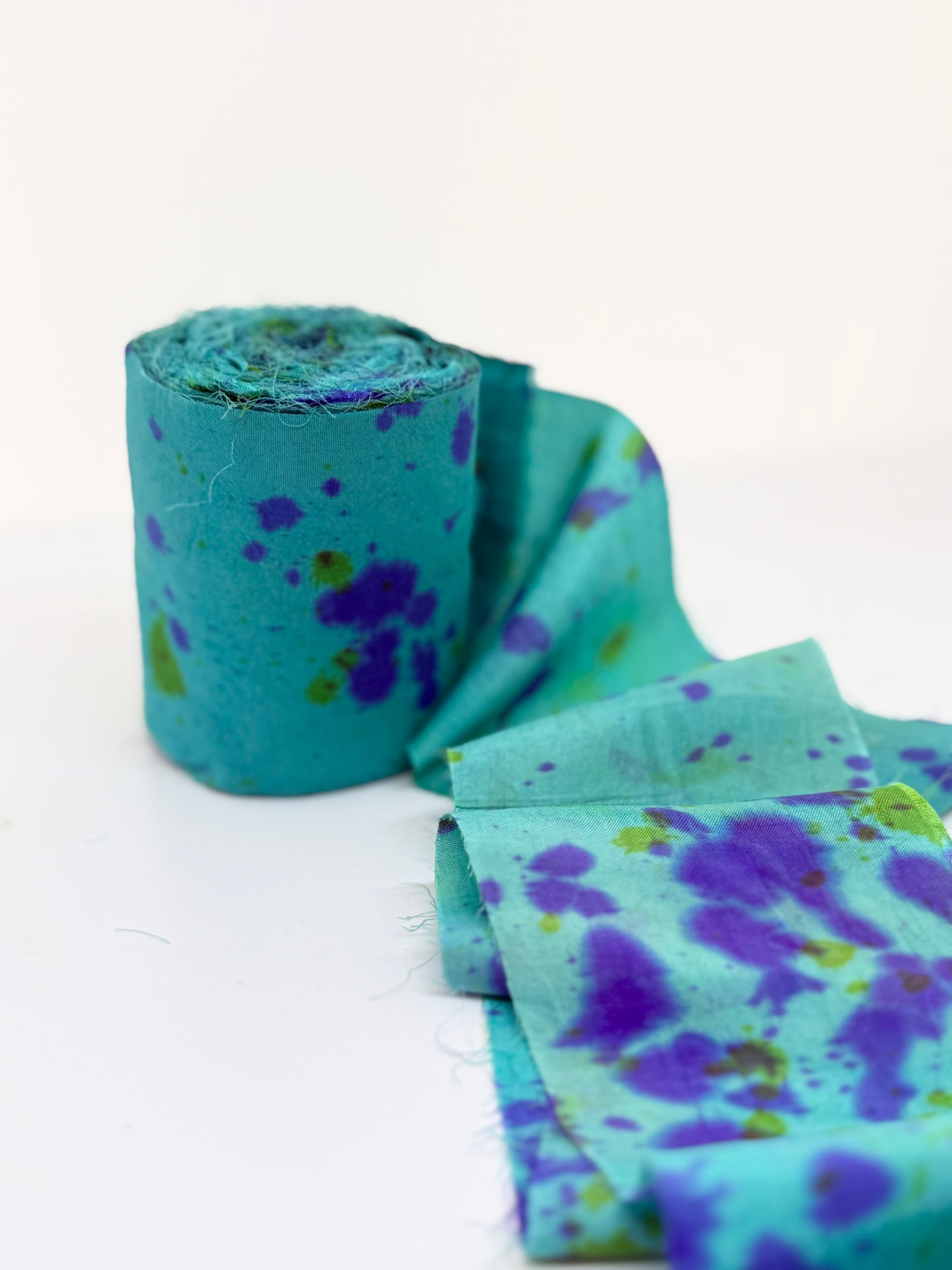 Sari silk fabric rolls hand spray dyed. Blue Reef