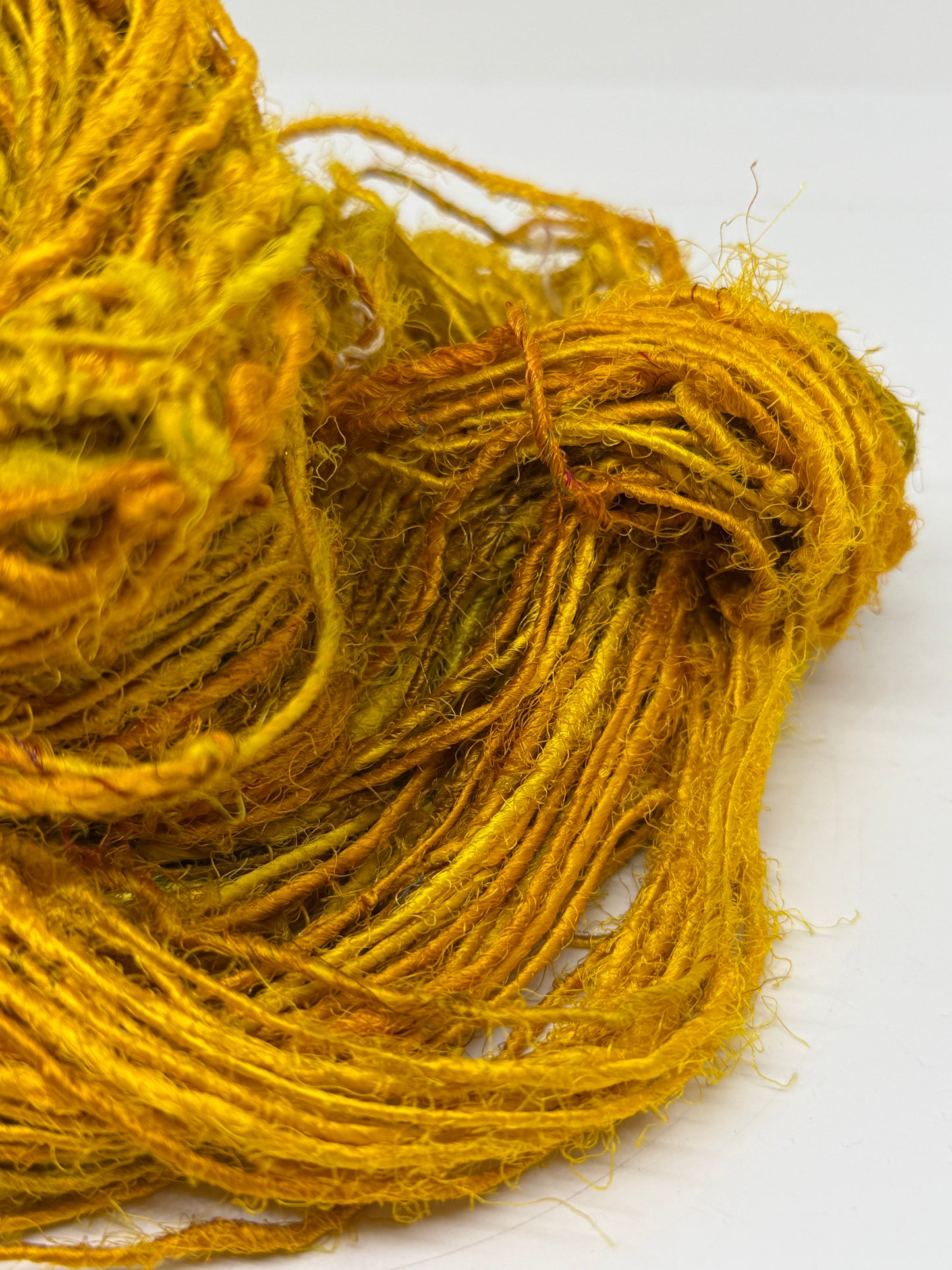 Sari silk yarn, golden yellow, waste silk handspun.