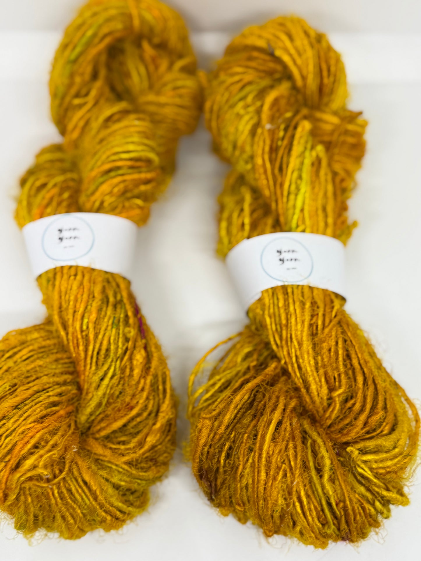 Sari silk yarn, golden yellow, waste silk handspun.