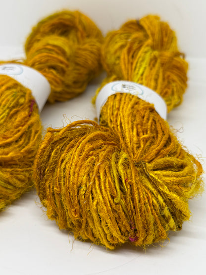 Sari silk yarn, golden yellow, waste silk handspun.