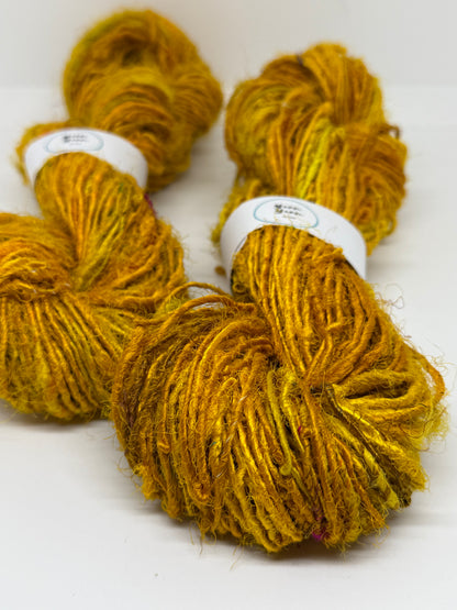 Sari silk yarn, golden yellow, waste silk handspun.