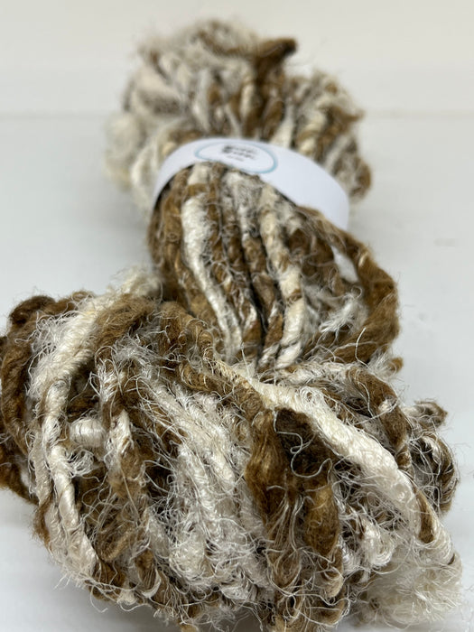 Recycled linen and peduncle raw silk yarn.