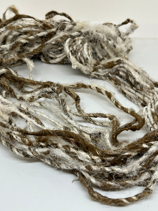 Recycled linen and peduncle raw silk yarn.