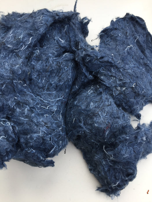 Recycled denim fibres left over from manufacturing.